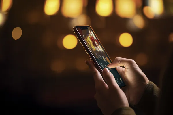 A close-up shot of golden coins falling around a spinning roulette wheel, representing immersive casino action at GOOB111.