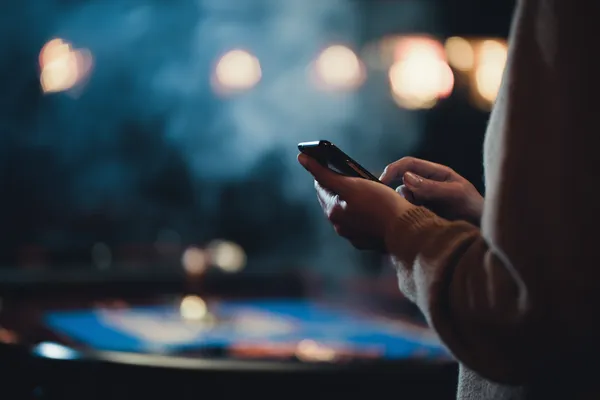 A glowing roulette wheel with cascading chips, symbolizing the engaging live and instant-win games available on GOOB111.