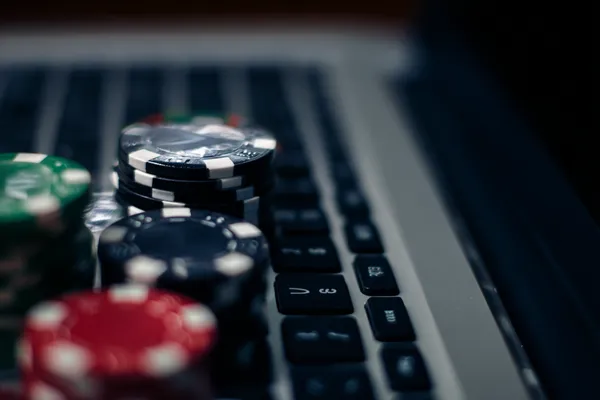 GOOB111 Jackpot Slots — Spin for massive rewards A dramatic shot of winning sevens landing on a slot reel surrounded by shining gold coins, symbolizing big wins.